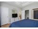 View of a bedroom with a tray ceiling, white walls, and closet at 6015 Catalina Dr. # 634, North Myrtle Beach, SC 29582