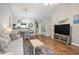 Spacious living room with hardwood floors seamlessly connected to the dining area and kitchen at 6015 Catalina Dr. # 634, North Myrtle Beach, SC 29582