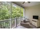 Screened porch with furniture and a TV at 6015 Catalina Dr. # 634, North Myrtle Beach, SC 29582