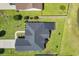 Aerial view of the property showcasing the well-maintained lawn, dark roof, and neat landscaping at 605 Fieldwoods Dr., Conway, SC 29526