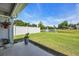 Relaxing backyard featuring a pond with fountain and white picket fence providing privacy at 605 Fieldwoods Dr., Conway, SC 29526