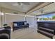 Outdoor living space features comfortable seating, a hot tub, and views of the surrounding area at 605 Fieldwoods Dr., Conway, SC 29526