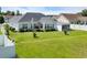 Spacious backyard with lush green grass and pristine landscaping offering a peaceful retreat at 605 Fieldwoods Dr., Conway, SC 29526