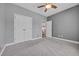 Bright bedroom with carpet, ceiling fan, and access to the rest of the house at 605 Fieldwoods Dr., Conway, SC 29526