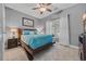 Cozy bedroom with a comfortable bed, ceiling fan, and ample natural light at 605 Fieldwoods Dr., Conway, SC 29526