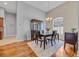 Elegant dining room with modern chandelier, stylish furniture, and natural light at 605 Fieldwoods Dr., Conway, SC 29526