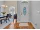 Welcoming entryway with decorative glass door and adjacent dining area with ample natural light at 605 Fieldwoods Dr., Conway, SC 29526