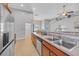 Modern kitchen features a double sink, stainless steel appliances, and eat-in dining area at 605 Fieldwoods Dr., Conway, SC 29526