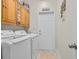 Functional laundry room features modern washer and dryer with storage at 605 Fieldwoods Dr., Conway, SC 29526