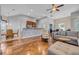 Open-concept living room featuring hardwood floors seamlessly flowing into other areas at 605 Fieldwoods Dr., Conway, SC 29526
