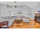 Comfortable living room featuring a sectional sofa, ceiling fan and hardwood floors at 605 Fieldwoods Dr., Conway, SC 29526