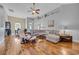 Open-concept living room with hardwood floors and seamless flow to the dining area at 605 Fieldwoods Dr., Conway, SC 29526