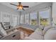 Inviting sun room with beautiful wood floors and a view of the outdoors at 605 Fieldwoods Dr., Conway, SC 29526