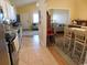 Open-concept layout features a kitchen with tile flooring and easy access to the adjacent dining and living rooms at 620 Wave Rider Ln. # B10-1, North Myrtle Beach, SC 29582