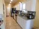 Well-lit kitchen featuring white cabinetry, granite countertops, and stainless steel appliances at 620 Wave Rider Ln. # B10-1, North Myrtle Beach, SC 29582