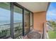 Balcony view with seating overlooking the ocean and parking lot at 6900 N Ocean Blvd. # 421, Myrtle Beach, SC 29572