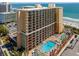 Aerial view of the oceanfront resort with multiple pools and ocean views at 6900 N Ocean Blvd. # 421, Myrtle Beach, SC 29572