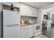 Bright kitchenette with modern appliances and access to the dining area at 6900 N Ocean Blvd. # 421, Myrtle Beach, SC 29572
