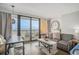 Cozy living room with ocean views from the balcony, featuring modern furniture and decor at 6900 N Ocean Blvd. # 421, Myrtle Beach, SC 29572