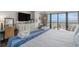 Comfortable bedroom with ocean view, featuring a large bed, dresser, and balcony access at 6900 N Ocean Blvd. # 421, Myrtle Beach, SC 29572