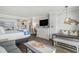 Comfortable bedroom with ocean views and decor, featuring a large bed, work space, and kitchenette at 6900 N Ocean Blvd. # 421, Myrtle Beach, SC 29572