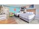 Spacious bedroom with two beds and a bright, beachy color scheme at 7200 N Ocean Blvd. # 224, Myrtle Beach, SC 29572