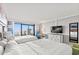 Bedroom with two beds and balcony featuring ocean views at 7200 N Ocean Blvd. # 224, Myrtle Beach, SC 29572