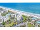 A breathtaking aerial view showcasing a beachfront condo, pool, and stunning ocean scenery at 741 Retreat Beach Circle # B-1-A, Pawleys Island, SC 29585