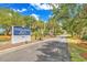 Sign for Sandpiper Run Building B at 741 in a scenic setting with mature trees at 741 Retreat Beach Circle # B-1-A, Pawleys Island, SC 29585