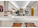 Well-lit kitchen with eat in bar, white cabinets, and stainless steel appliances at 741 Retreat Beach Circle # B-1-A, Pawleys Island, SC 29585