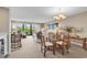 Spacious living and dining area with lots of natural light from the large sliding doors to the balcony at 741 Retreat Beach Circle # B-1-A, Pawleys Island, SC 29585