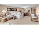 Spacious living room flows into dining area, with white sofas and coastal-inspired decor at 741 Retreat Beach Circle # B-1-A, Pawleys Island, SC 29585