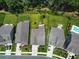 An aerial view of several homes with green lawns, and manicured landscaping, set along a neighborhood street at 748 Old Murrells Inlet Rd., Murrells Inlet, SC 29576