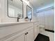 Bright bathroom features double sinks, white cabinetry, black hardware and tile floors at 748 Old Murrells Inlet Rd., Murrells Inlet, SC 29576
