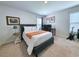 Bedroom with neutral carpet, bed, desk, and guitar at 748 Old Murrells Inlet Rd., Murrells Inlet, SC 29576