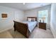 Bedroom with carpet, wooden sleigh bed, nightstand and natural light at 748 Old Murrells Inlet Rd., Murrells Inlet, SC 29576