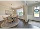 Cozy dining room featuring a round table, elegant chairs, and a view to the outdoors at 748 Old Murrells Inlet Rd., Murrells Inlet, SC 29576
