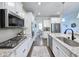 Open concept kitchen features a center island, stainless appliances, and ample counter space at 748 Old Murrells Inlet Rd., Murrells Inlet, SC 29576