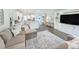 Open floorplan featuring a large living room with sectional sofa connected to a bright modern kitchen at 748 Old Murrells Inlet Rd., Murrells Inlet, SC 29576