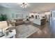 Open concept living room flows into modern kitchen with island, stainless appliances, and breakfast bar at 748 Old Murrells Inlet Rd., Murrells Inlet, SC 29576