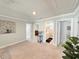 Upstairs living area with neutral carpet, plant, and doors to other rooms at 748 Old Murrells Inlet Rd., Murrells Inlet, SC 29576