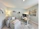 Comfortable home office featuring a desk with dual monitors, a plush chair, and a cozy seating area at 748 Old Murrells Inlet Rd., Murrells Inlet, SC 29576