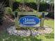 Community entrance sign for Vanns Landing, nestled amongst flowers and greenery at 748 Old Murrells Inlet Rd., Murrells Inlet, SC 29576