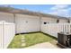 Enclosed backyard featuring green grass, concrete patio, and white fencing at 750 Howard Ave. # E, Myrtle Beach, SC 29577