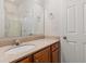 Bathroom with a single sink, wood cabinets, and granite countertops at 750 Howard Ave. # E, Myrtle Beach, SC 29577