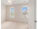 Bright bedroom with arched windows, neutral carpet, and ample natural light at 750 Howard Ave. # E, Myrtle Beach, SC 29577