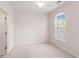 Cozy bedroom with neutral walls, carpet, and a window with blinds for natural light at 750 Howard Ave. # E, Myrtle Beach, SC 29577