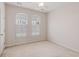 Neutral bedroom with carpet, ceiling fan and two windows with blinds at 750 Howard Ave. # E, Myrtle Beach, SC 29577