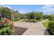 Beautiful courtyard featuring benches surrounded by lush landscaping and brick-paved walkways at 750 Howard Ave. # E, Myrtle Beach, SC 29577