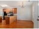 Open kitchen and dining area with granite countertops, stainless steel appliances, and hardwood flooring at 750 Howard Ave. # E, Myrtle Beach, SC 29577